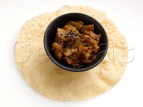 Aubergine pickle on a poppadom