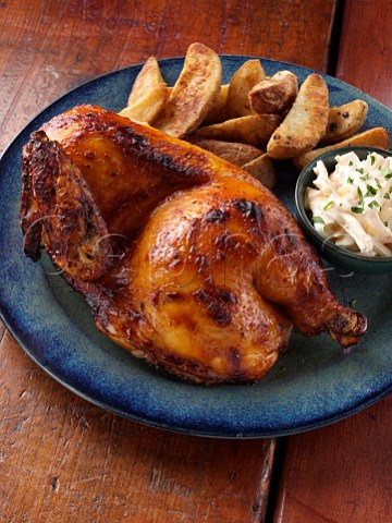 Half a Spatchcocked chicken Piri Piri with coleslaw and spicy potato wedges