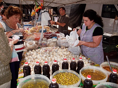 Market stall selling olives oil garlic and spices El Bosque Sierra de Cdiz Andaluca Spain