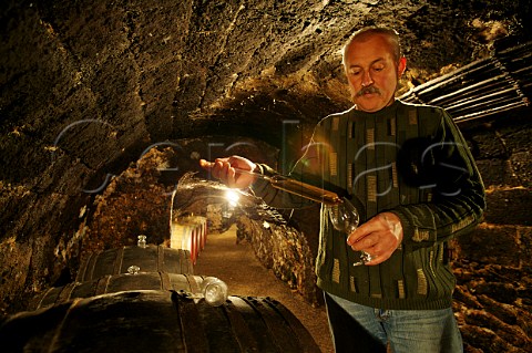Istvn Turoczi tasting from barrel in a cellar of the Royal Tokaj Wine Company  Md Hungary   Tokaji