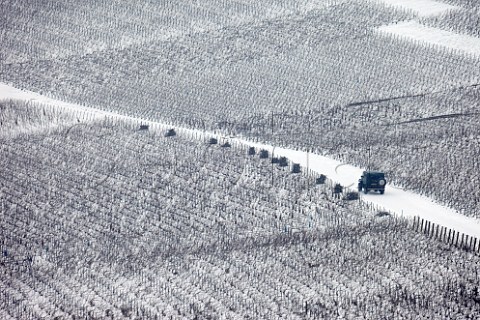 Driving through vineyards in falling snow Hautvillers near pernay Marne France  Champagne