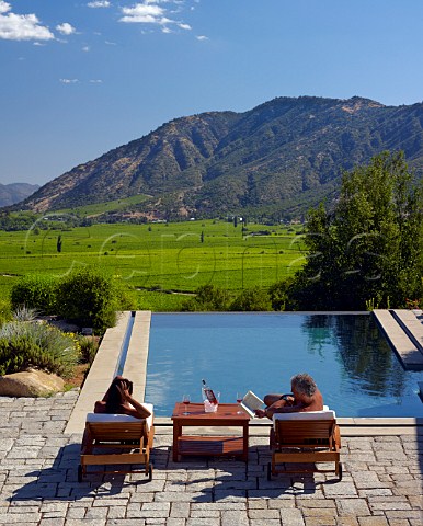 Couple by the pool of the Lapostolle hotel at Clos Apalta Colchagua Valley Chile