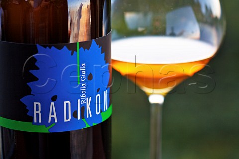 Bottle and glass of Radikon Ribolla Gialla at sunset   Oslavia Friuli Italy Collio