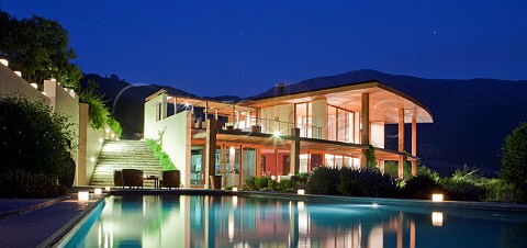 Swimming pool and restaurant of the Lapostolle Relais  Chateaux hotel at Clos Apalta winery Colchagua Valley Chile