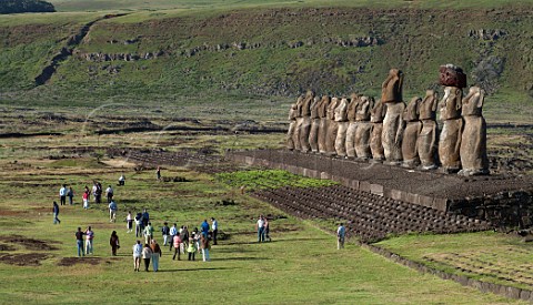Tourists at Ahu Tongariki which has 15 Moais the most standing in one place one of which still has its topknot Easter Island