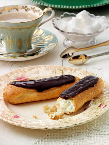 Eclairs in a table setting