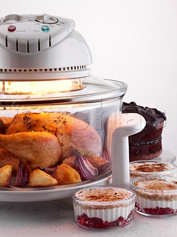 Halogen oven with chicken cooking