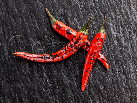 Flamed red chili peppers chillies