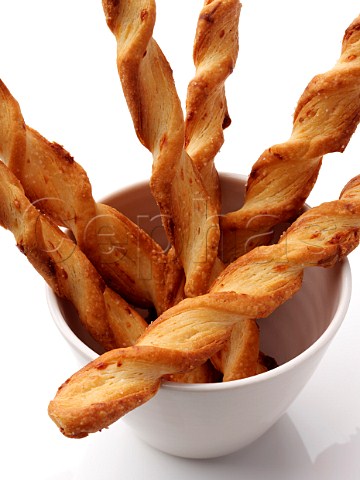 Cheese twists straws on a white background