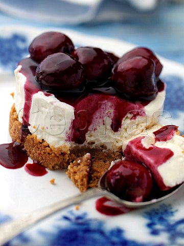 Individual gluten free cherry cheesecake on an antique plate