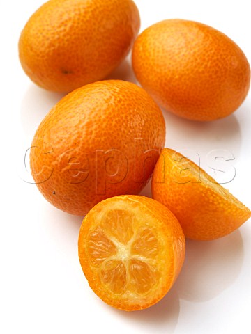 Fresh ripe kumquats on a white background