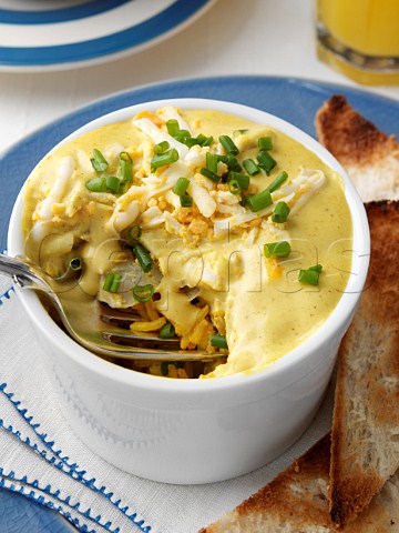 Individual portion of gourmet kedgeree in a white ramekin