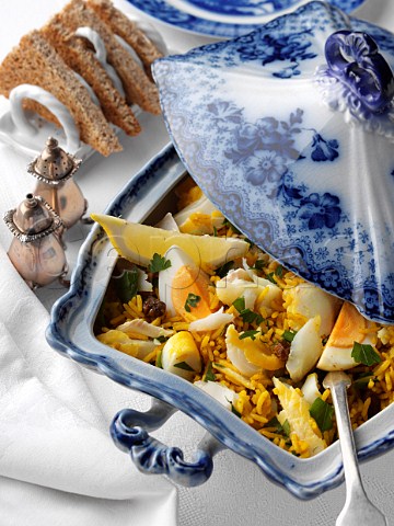 Serving dish of kedgeree with toast