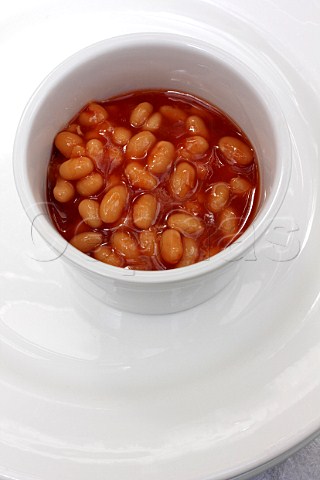 White ramekin of baked beans
