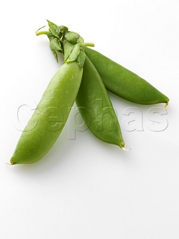 Sugar snap peas on a white background
