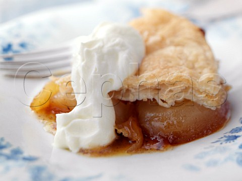 Individual portion of caramelized apple pie on an antique plate