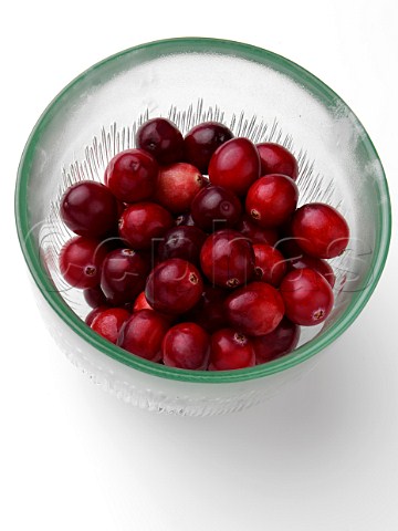 Ripe cranberries in a glass bowl