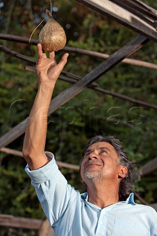 Alvaro Espinoza with a stags bladder for use in biodynamic treatment of his vineyard Antiyal Maipo Alto Chile