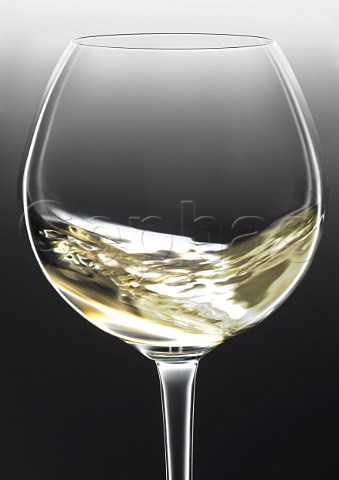 Swirling a glass of Newton Johnson chardonnay
