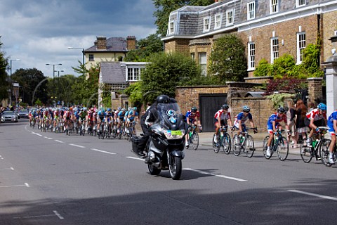 London Surrey Cycle Classic August 2011  The peloton headed by mainly British riders leading Mark Cavendish near Hampton Court on the return journey into London