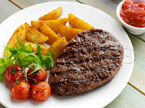 Grilled steak wedges and tomatoes