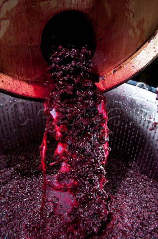 Emptying the solid matter skins and pips into a basket press after fermentation in  barrique to obtain the press wine Cuve Spciale Pby Faugres  Chteau Faugres StEtiennedeLisse near Saintmilion Gironde France Stmilion  Bordeaux