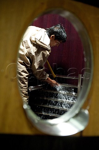 Cleaning the interior of a temperaturecontrolled fermenter  Chteau Faugres StEtiennedeLisse near Saintmilion Gironde France Stmilion  Bordeaux