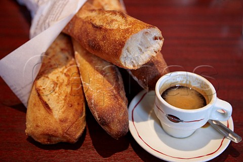 Cup of espresso coffee with baguettes on a caf table Paris France