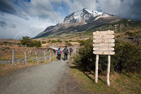Information sign at start of the trek to the Granite Pillars with Monte Almirante Nieto in distance Torres del Paine National Park Patagonia Chile