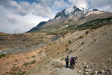 Trekking in Torres del Paine National Park with Monte Almirante Nieto in distance Patagonia Chile