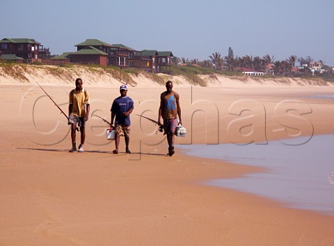Men going fishing at Coco Cabanas beach resort Ponta do Ouro southern Mozambique