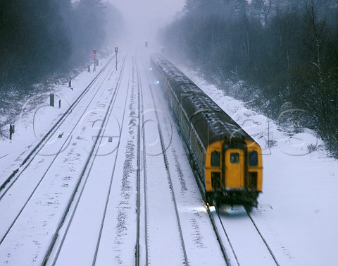 Train on snow covered tracks England