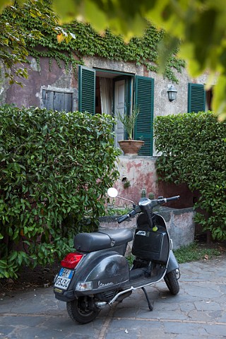 Scooter in garden of Villa Trinita Mascalucia near Catania Sicily