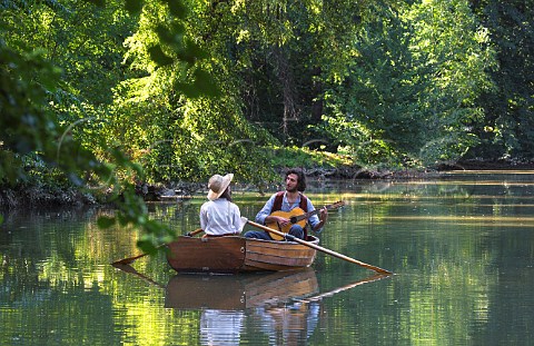 Couple in boat on lake in the park of Il Torrione Pinerolo Piemonte Italy