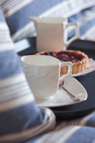 Coffee cup and fruit tart