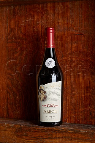 Bottle of Grevillire Trousseau in cellar of Domaine Daniel Dugois Les Arsures Jura France  Arbois