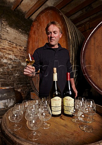 Frdric Lornet pouring Savagnin and Trousseau in his winery tasting room the former Cistercian LAbbaye de Genne  MontignylsArsures Jura France Arbois