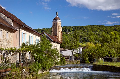 glise Saint Just viewed over the Cuisance River with the Chapelle de lHermitage on hill in distance Arbois Jura France
