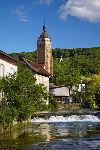 glise Saint Just viewed over the Cuisance River with the Chapelle de lHermitage on hill in distance Arbois Jura France