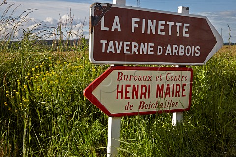 Signs for Henri Maires head office and winery Boichailles and La Finette Taverne dArbois Arbois Jura France