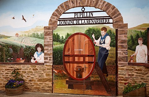 Mural depicting JeanMichel Petit and family on wall of Domaine de la Renardire Pupillin near Arbois Jura France  ArboisPupillin