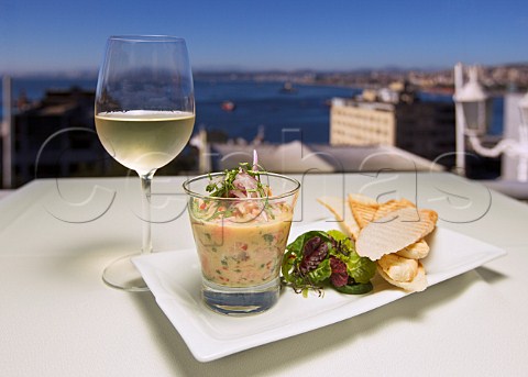 Ceviche served with a glass of Sauvignon Blanc on the terrace of Caf Turri  overlooking the bay of Valparaiso Chile