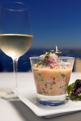 Ceviche served with a glass of Sauvignon Blanc on the terrace of Caf Turri overlooking the bay of Valparaiso Chile