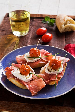 Cherry tomato ham and goats cheese pintxos