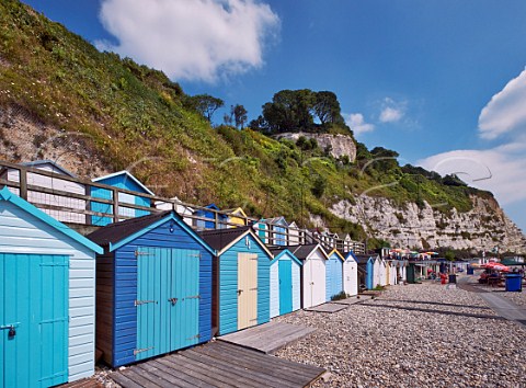 Beach huts below the cliffs at Beer South Devon UK