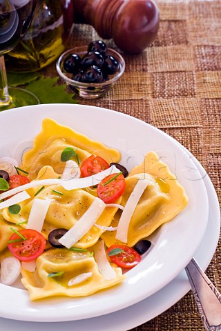 Ravioli with tomatoes and Parmesan cheese