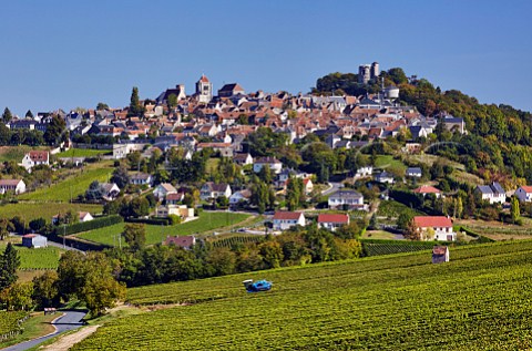 Machine harvesting Sauvignon Blanc in vineyard below the hilltop town of Sancerre Cher France  Sancerre