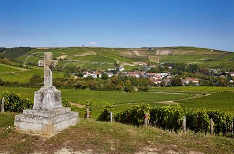 Stone cross in vineyards above Bu with Clos de la Poussie in distance beyond the village Cher France   Sancerre