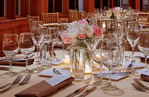 Tables laid for dinner in the Carriage House of Trump Winery  Charlottesville Virginia USA