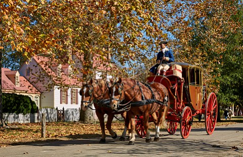 Horsedrawn carriage passing St George Tucker House on Nicholson Street Colonial Williamsburg Virginia USA